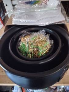 lot 1771 image: Black plastic St Patricks Day pot of gold with rainbow cardboard