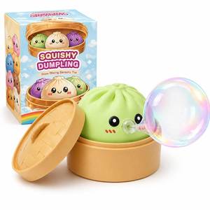 lot 12136 image: Dumpling Squishy Mystery Box - Squishy Dumpling with Bubble Blowing Feature, Bao Bun Stress Relief Toy, Soft Sensory Fidget Squeeze Toy with Steamer Box, Cute Desk Gift (Green)