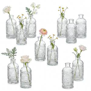 lot 5825 image: Kingrol 12 Pack Mini Glass Bud Vases, Small Clear Flower Vases for Single Stems, 4.9 Inch Vintage Embossed Bottles for Home Shelf, Bathroom and Desk Decor