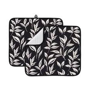 lot 2215 image: Kitchen place mat approximately 18x18 in black white flowers