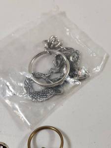 lot 323 image: Assorted Keychain Collection with Dragon and Dreamcatcher Designs