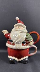 lot 73 image: Santa Glazed Pottery Mug Warming Tea Pot