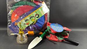 lot 116 image: Gardening Bundle Includes Fiskars Tool and Large Wind Spinner