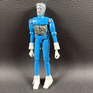 lot 81 image: $$ Vintage 1976-1980 Mego Micronauts Time Traveler figure, features a solid powder blue opaque body with a silver head.The figure includes a detachable chrome chest plate