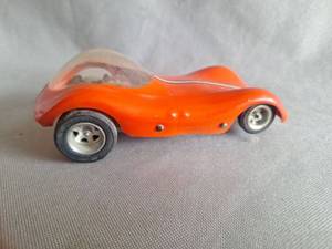 lot 509 image: RARE Vintage CLASSIC MANTA RAY GTX with LOTUS 30 body 124 SCALE Slot Car AND Vintage Cox Slot Car hand Controller- Clear Ruby Red