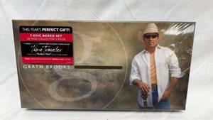 lot 51 image: Garth Brooks 7-Disc Boxed Set with Collectors Book and Triple Live Album