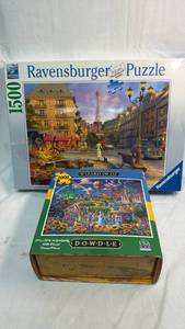 lot 88 image: Ravensburger 1500 Piece Paris Puzzle and Dowdle 1000 Piece Wizard of Oz Puzzle Bundle