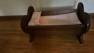 lot 50620 image: Wooden Doll Bed with Pink Bedding