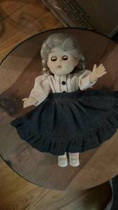 lot 50648 image: Porcelain Doll in Traditional Dress with Gray Hair