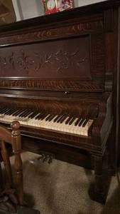 Russell Upright Piano with Ornate Wood Carvings