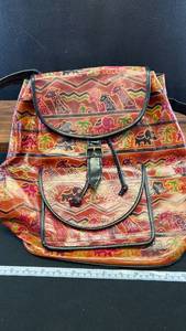 lot 60462 image: Handcrafted Leather Backpack with Elephant and Animal Print Design