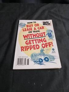 lot 5748 image: Car Buying Guide Book and AutoTrader Advertisement