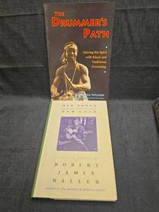 lot 50168 image: Two Music Books - The Drummers Path and Old Songs in a New Cafe
