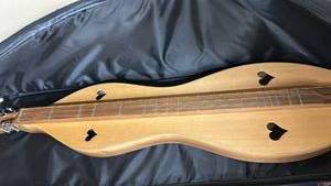 lot 774 image: McSpadden Dulcimer with Heart Sound Holes like new, purchased in Ozark, MO