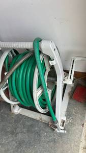 lot 798 image: Garden Hose Reel with Green Hose