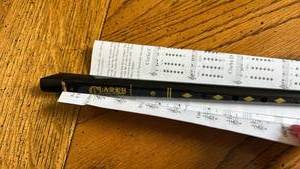 lot 863 image: Clark Tin Whistle with Music Sheets