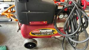 lot 898 image: Coleman Powermate 5 Gallon Portable Air Compressor