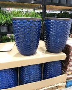lot 59902 image: Blue ceramic wave planter with Faux Plant