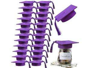 lot 24024 image: Mindsoft 24 Pcs 2026 Graduation Cap Decorations Mason Jar Lid with Tassels 4.2 Inch Grad Hat Large Mason Can Toppers for 2026 Graduation Party Supplies Table (Purple) - Retail $19