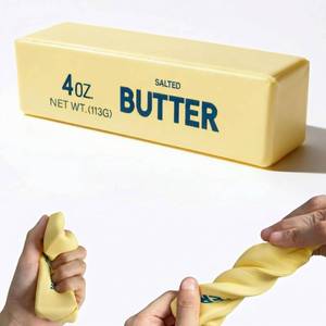 lot 28018 image: Slow Rising Butter Squishy, Stress Relief Toy for Adults, Squeeze Stretch Toy for Anxiety Relief, Soft Squishy Fidget Toys - Retail $6