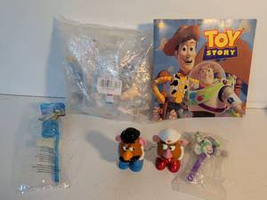 lot 28 image: Disney Toy Story Mr. and Mrs. Potato Head with Buzz Lightyear Curly Straw and Golden Books