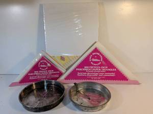 lot 164 image: Wilton Cake Decorating Supply Lot with Metal Cake Pans and Parchment Triangles