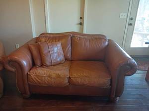 lot 901 image: American Home Collection by LaZboy Brown Leather Love Seat.  35 x 70 x 40.  Located in Basement.  Basement has a walkout