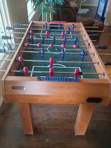 lot 902 image: Harvard Multi Game Table.  Billiards Table, Hockey Table, Shuffle Board, Soccer and Table Tennis.  Billiard Balls are located under table.  See pictures.  33 x 55 x 50.  Appears all pieces are there.  Located in Basement with Walkout