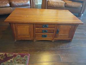 lot 907 image: Wooden Coffee Table.  17 x 50 x 30.  3 Drawers with Bottom Storage.   Located in Basement with Walkout