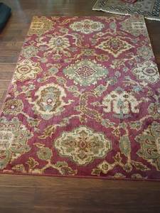 lot 908 image: Area Rug.  7ft x 5ft.  Located in Basement with Walkout