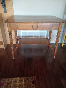 lot 910 image: Wooden Table with Drawer.  Bottom Shelf.  28 x 36 x 24.  Located in Basement with Walkout