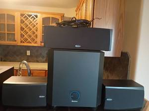 lot 912 image: Boston Surround Sound Speaker System.  Woofer is 13 x 12 x 15.   Located in Basement with Walkout