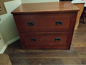lot 918 image: Winners Only Brand Wooden Lateral 2 Drawer Filing Cabinet.  Has a key.  30 x 37 x 22.   Located in Basement with Walkout