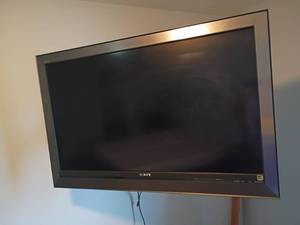 lot 924 image: 45in Sony Television with Remote.  Still on wall will need tools to take it down.   Located in Basement with Walkout