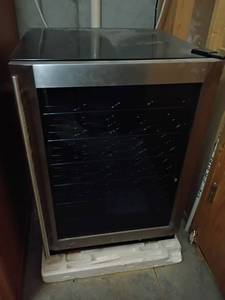 lot 933 image: Magic Chef Wine Cooler.  Holds 28 Bottles.  33 x 24 x 24.   Located in Basement with Walkout