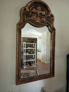 lot 945 image: Decorative Wall Mirror.  Fleur de Lis on top.   52 x 29