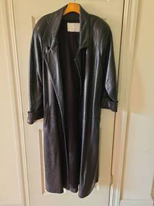 lot 1011 image: Womans Black Leather Long Trench Coat