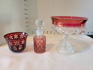 lot 1027 image: Ruby Red Flash Glass Collection - Bowl, Compote and Perfume Bottle Set