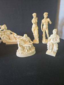 lot 1044 image: Ivory color figurines, male figure has arm glued