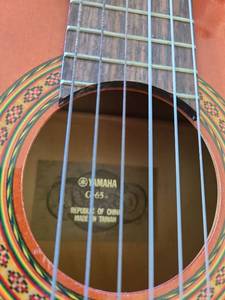 lot 1080 image: Yamaha CG65 Classical Guitar with Case