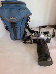 lot 1095 image: Canon AE-1 35mm Film Camera with Telephoto Lens and Kalimar Case