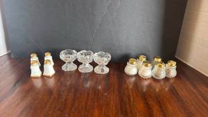 lot 1107 image: 3 clear glass pedestal salt cellars with mini salt and pepper shakers