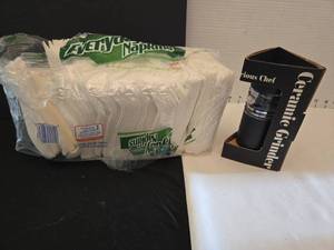 lot 1234 image: Ceramic grinder, NIB, and paper napkins