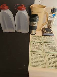 lot 1299 image: Drinking Game Coaster Set with Travel Mug and Water Bottles