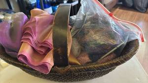 lot 1584 image: Yarn, needle, fabric in basket
