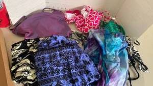 lot 1627 image: Bathing suits, sarongs and wrap around skirt with goggles