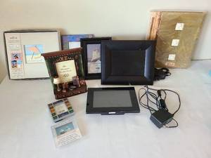 lot 1713 image: Digital picture frames, standard picture frames, photo albums.