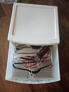 lot 2008 image: Hangers inside a Sterilite Storage Drawer. 10 x 20 x 20
