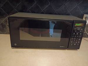 lot 2015 image: GE Spacemaker II Microwave.  11 x 24 x 12.  Located in Basement.