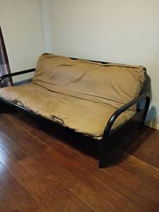 lot 2026 image: Futon Chair.  33 x 77 x 48.   Doesnt lay down.  See pictures.  Located in Basement with Walkout